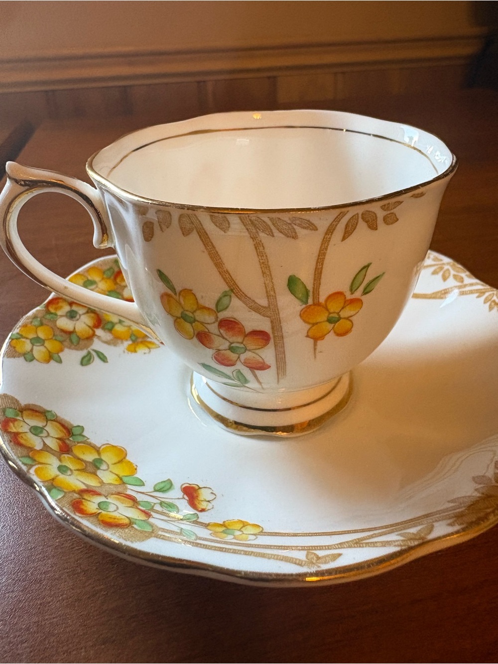 Royal Albert Dell White Teacup and Saucer with Yellow and Orange Floral Motif